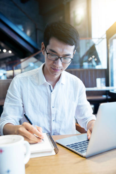 istock Young businessman in cafe 819506714