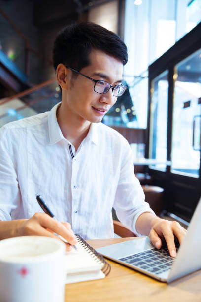 istock Young businessman in cafe 819506732