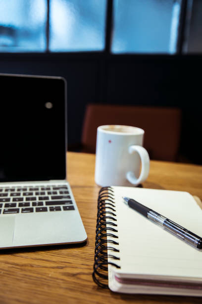 istock laptop,notebook and coffee cup in cafe 819517746