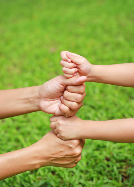 istock Hands of mother and daughter. 819521422