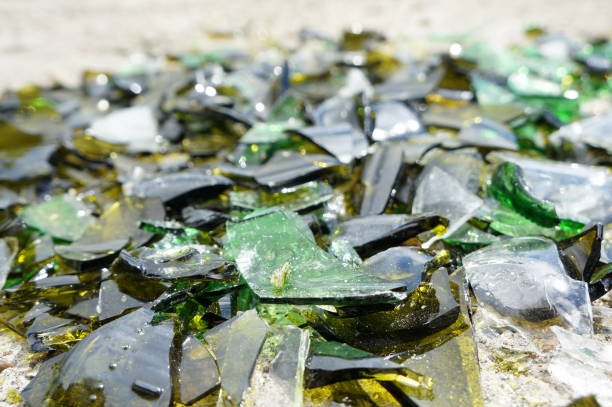 istock Fragments of colored broken glass on a concrete surface 819521794