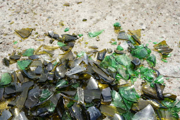 istock Fragments of colored broken glass on a concrete surface 819521822