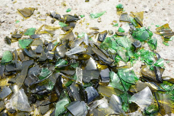 istock Fragments of colored broken glass on a concrete surface 819521826