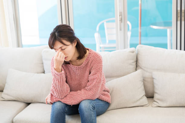 istock woman who has a pain in a head 819534926