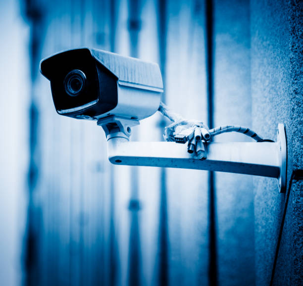 istock detail shot of CCTV security camera hanging on wall 819535140