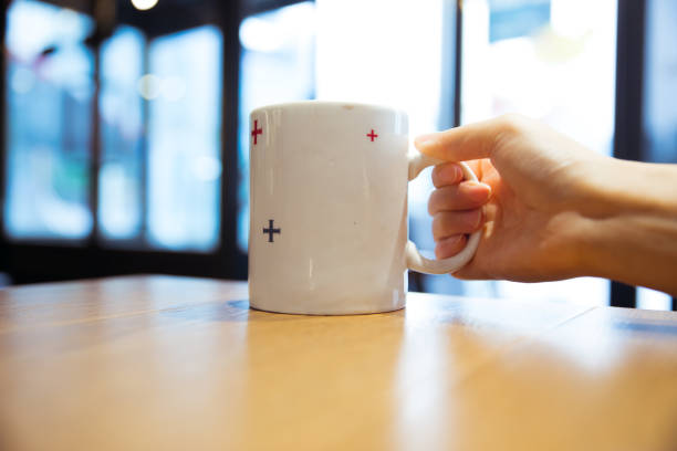 istock hand holding cup of coffee 819542802
