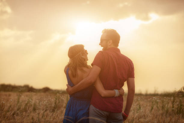 istock Couple enjoying outdoors in a wheat field. 819550966