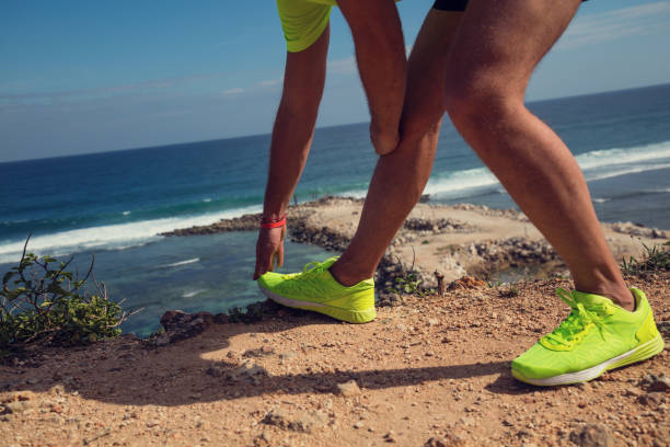istock Stretching after jogging / exercise on the sea / ocean shore. 819553320