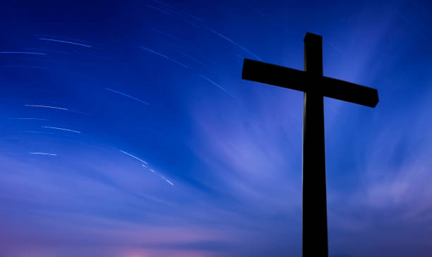 istock Cross over starry sky background concept of religion 819559502