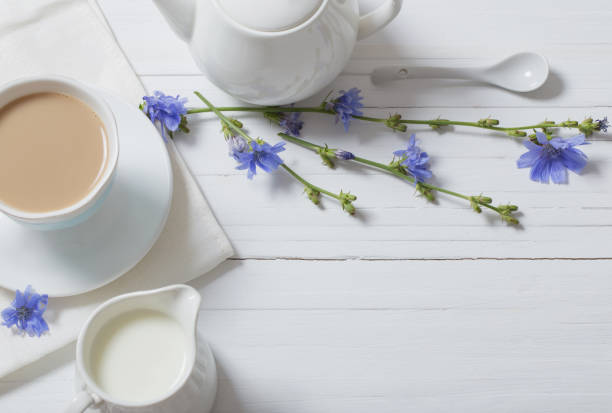istock Drink from chicory in a cup on the white wooden table 819565256