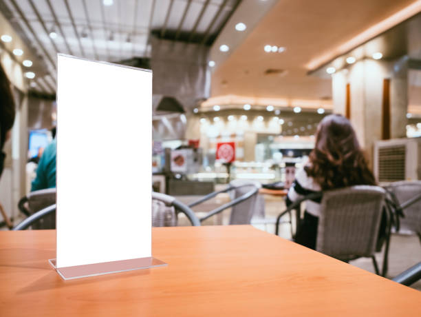 istock Mock up Menu frame on Table Bar restaurant cafe Background with people 819573892
