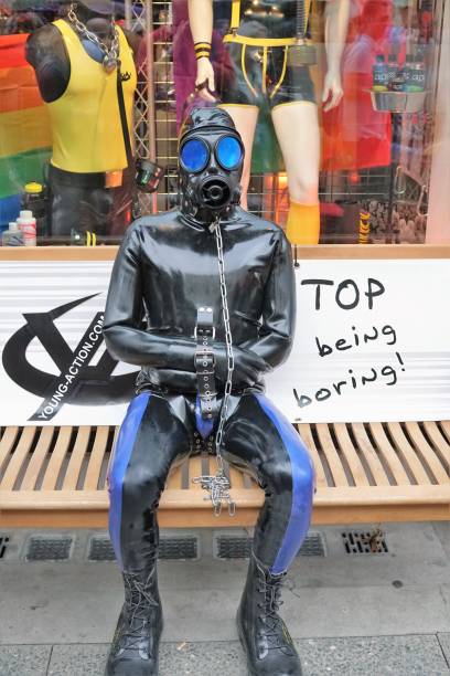 mannequin fully dressed in latex clothes - editorial vertical homosexual people imagens e fotografias de stock