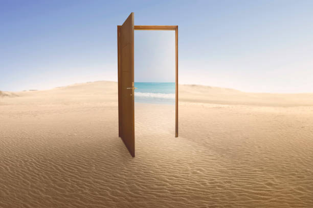 istock Open door with access to the beach from desert 819574298