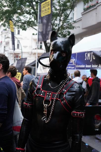 man with latex fetish wear during the 25th lesbian and gay festival in berlin - editorial vertical homosexual people imagens e fotografias de stock