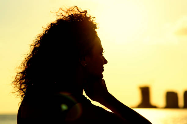 istock Woman watching the sunrise 819599092