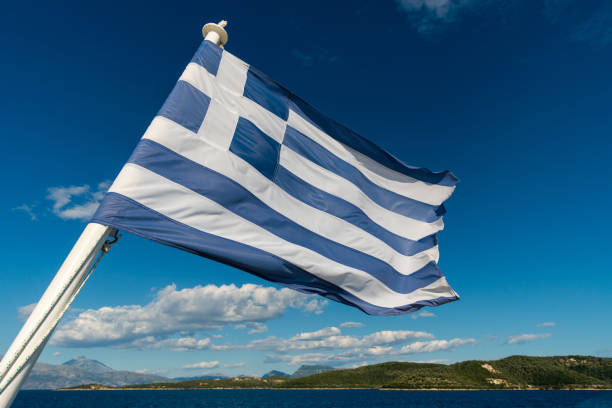 istock Flag of Greece with the sea 819604572