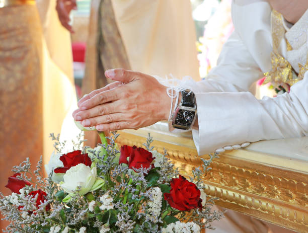 istock Hands pouring blessing water into bride's bands, Thai wedding. 819611930