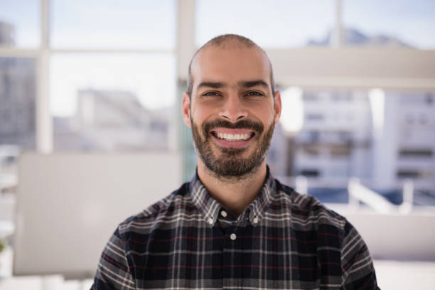 istock Portrait of smiling executive 819612100
