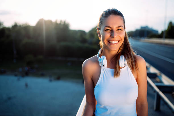 istock Portrait of woman taking break from jogging 819614968