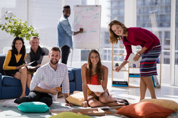 istock Portrait of happy executives working together 819615444