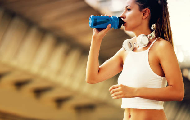 istock Portrait of woman taking break from jogging 819616256