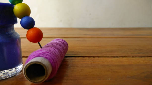 istock Color paints with sewing threads on wood background  and Colorful bubbles 819619778