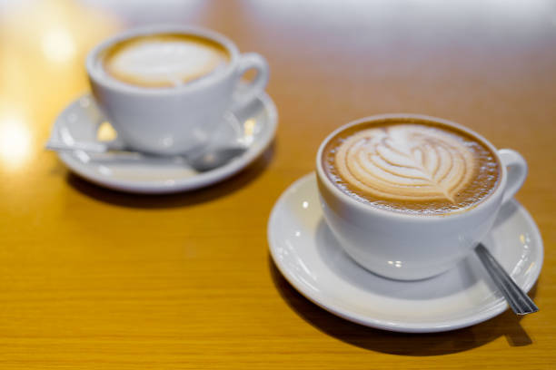 istock Cafe Mocha served on table and Classic Latte coffee on background 819633148