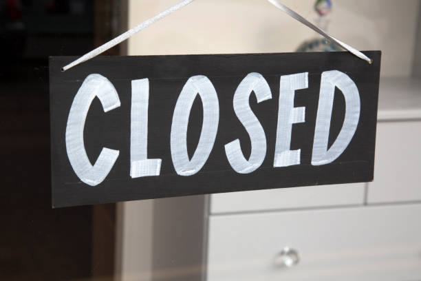 istock Closed Sign on Shop Window 819640346