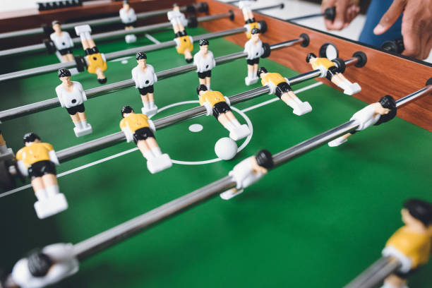istock close up view of man playing table football during break 819640366