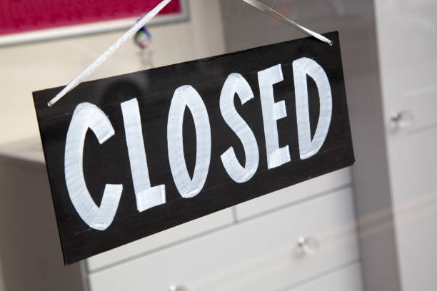 istock Closed Sign on Shop Window 819643518