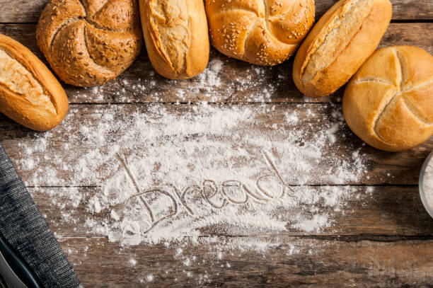 istock white flour on wooden bread 819650712