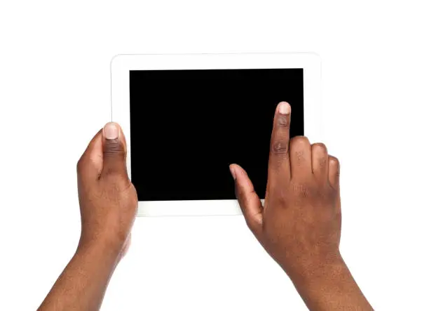 Photo of Holding and pointing to blank screen on tablet