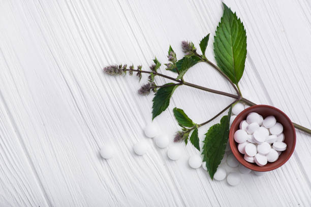 istock Natural organic pills with herbal plant 819659190