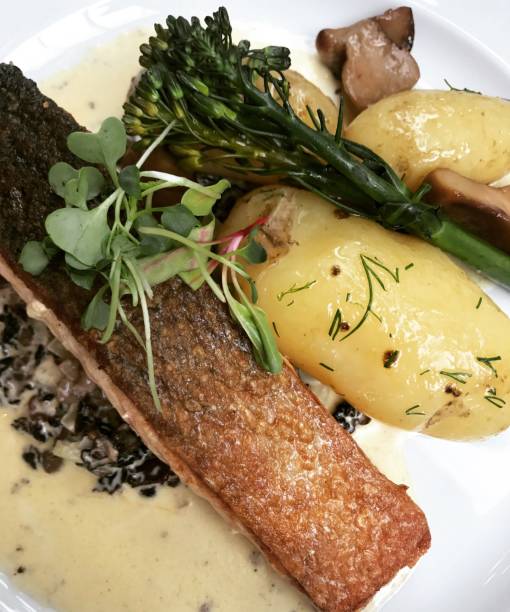 istock Slightly smoked and grilled salmon steak with boiled potato 819659642