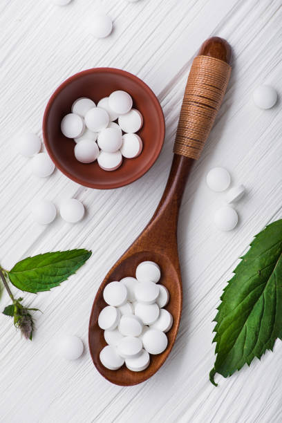 istock Natural organic pills with herbal plant 819661932