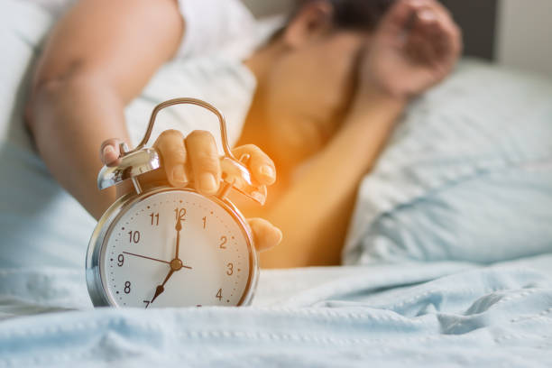 istock Clock on the bed in the morning. 819665362