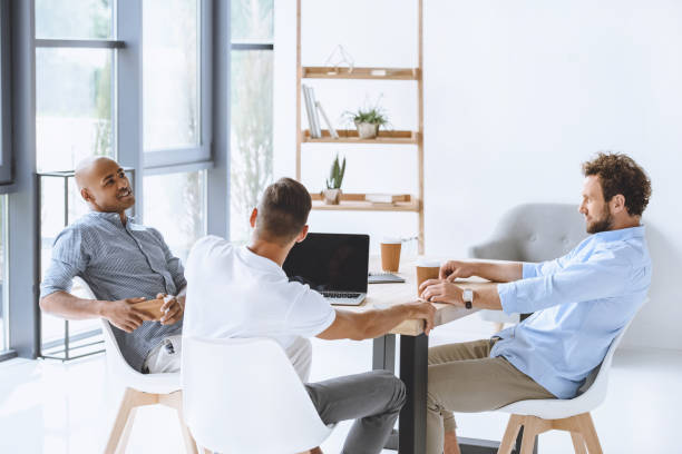 istock multicultural business people discussing business strategy at meeting in office 819665892