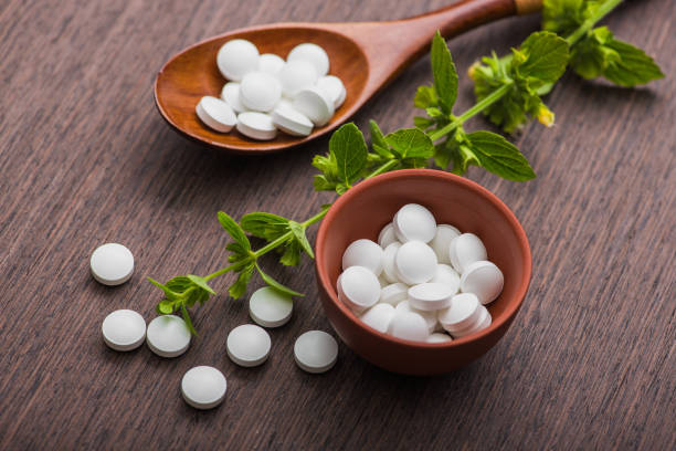 istock Organic medical pills with herbal plant 819666364