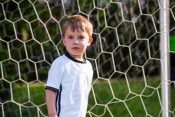 istock Child in a soccer field 819670362