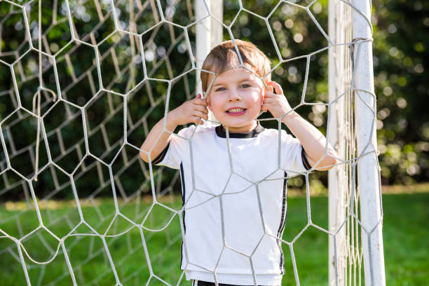 istock Child in a soccer field 819670366