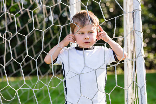 istock Child in a soccer field 819670400