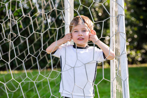 istock Child in a soccer field 819670402