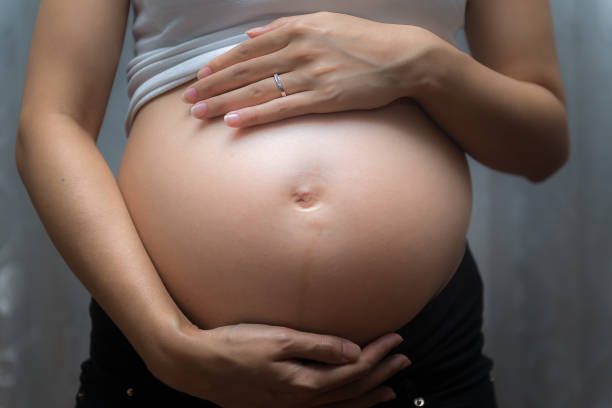 istock Pregnant woman touch her tummy 819673674