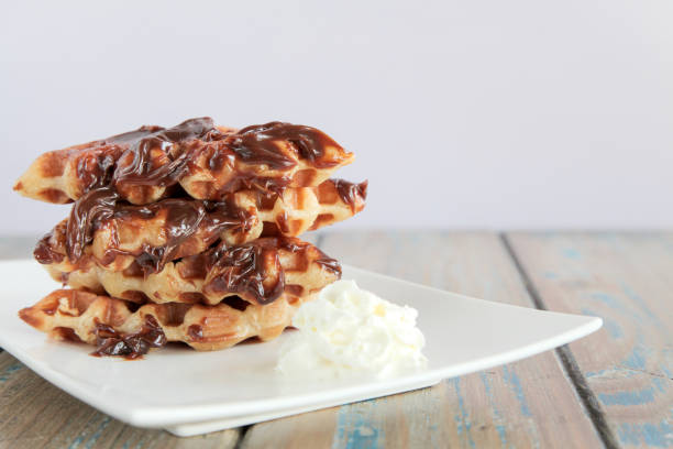 istock Chocolate fudge waffle with whipped cream 819673680