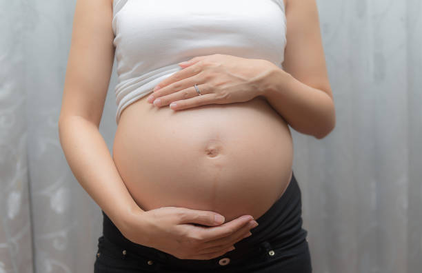 istock Pregnant woman touch her tummy 819674036
