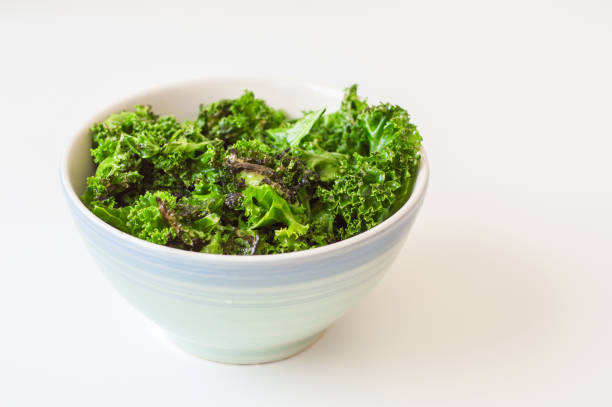 istock Kale chips and fresh kale leaves  blue bowl 819677598