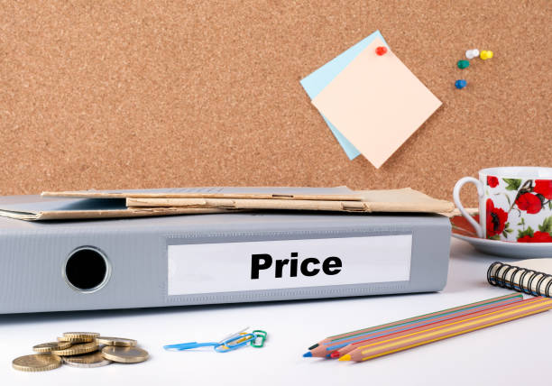 istock Price. Folder on office desk. Money, Coffee Mug and colored penc 819686728