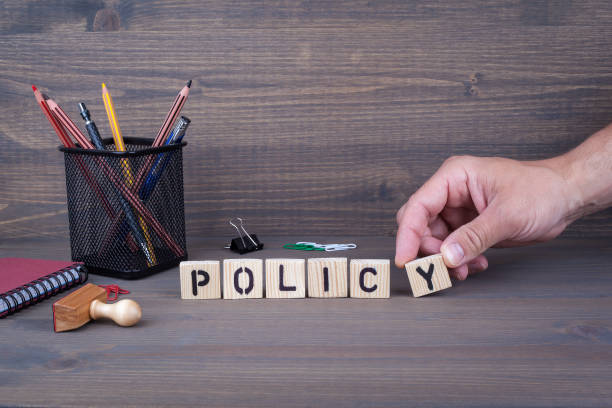 istock policy. Wooden letters on dark background 819686824