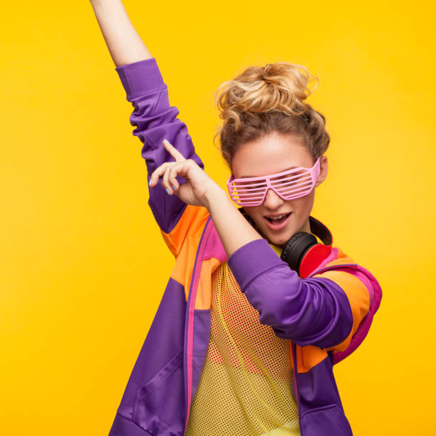 istock Trendy youngster dancing on orange 819699910