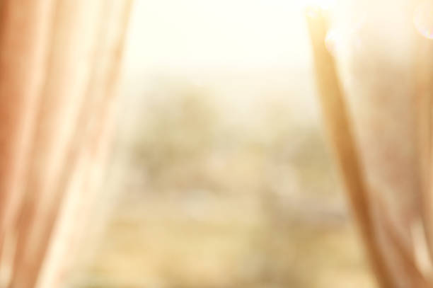 istock Abstract and blurry image of window with curtains 819700136